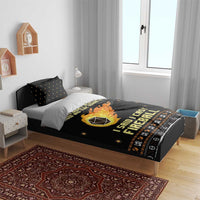 Black bedding set with fireball artwork across duvet and two matching pillowcases