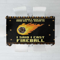 Black Christmas tablecloth with orange fireball graphic, bold text, and star accents