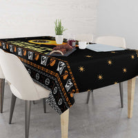 Black tablecloth corner drape with orange fireball, dice icons, and star pattern