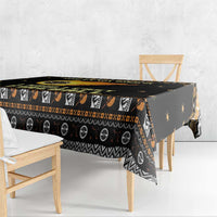 Black tablecloth over rectangular table with patterned border and small star print