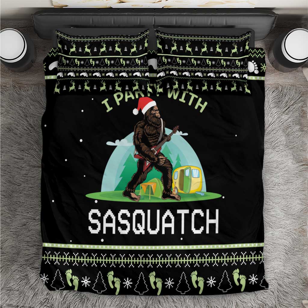 Black duvet cover and pillow set with Sasquatch campsite graphic and green holiday border