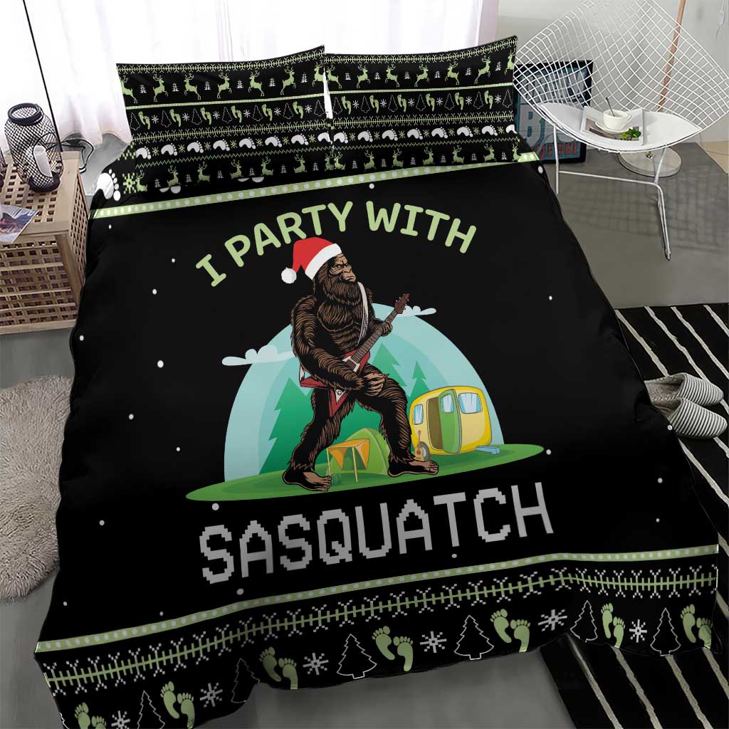Black camping bedding set with Sasquatch graphic, green trim, and patterned pillows