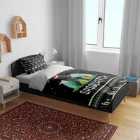 Black camping bedding set with Sasquatch print and green decorative border on bed