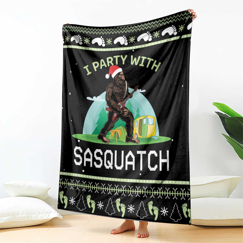 Black camping blanket featuring Sasquatch by a tent and large “SASQUATCH” lettering