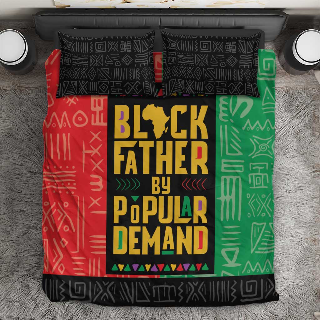African bedding set: red/green/black duvet with 'Black Father by Popular Demand' graphic.