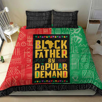 African bedding set on bed: duvet with 'Black Father by Popular Demand' panel in red and green.