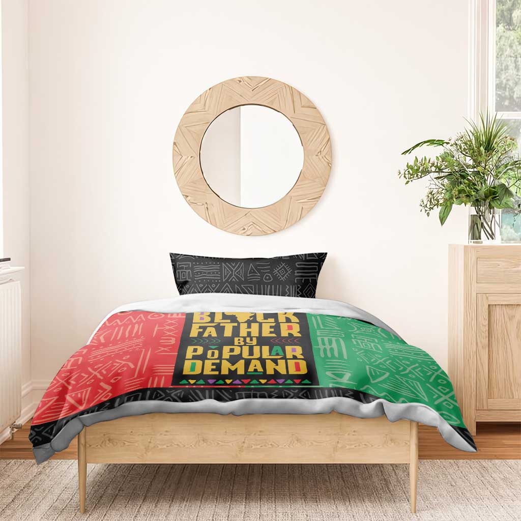 African bedding set: red/green duvet with 'Black Father by Popular Demand' design and black trim.