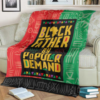 Red and green African blanket with large centered black “Black Father” lettering