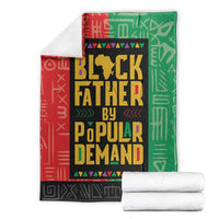 Folded African blanket set in red, green, and black with bold centered text design