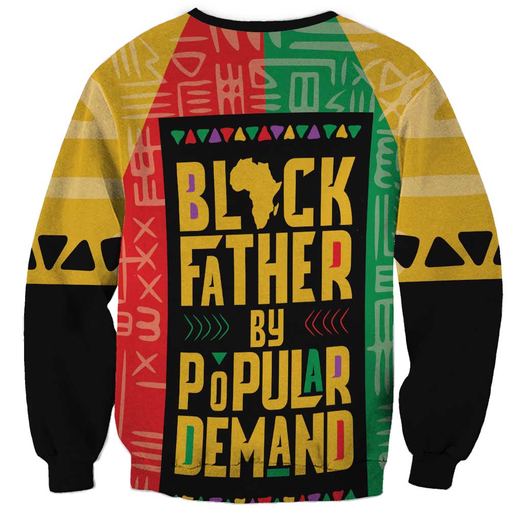 Unisex African sweatshirt, angled front view, bold multicolor “Black Father by Popular Demand” print