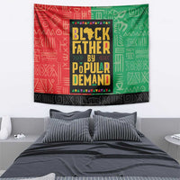 African tapestry with red-and-green border, black center block, and yellow lettering