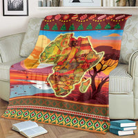 Red Africa map Christmas blanket draped over sofa with green tree and ornament row
