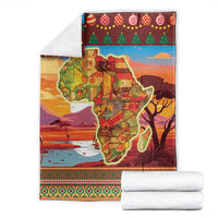Red Africa map Christmas blanket folded with holiday trees, ornaments, and striped border