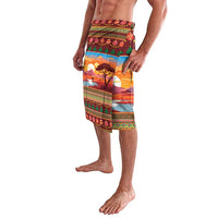 Men's red patterned lavalava draped over legs, landscape and holiday motifs
