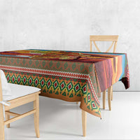 Christmas tablecloth corner over bench, featuring green tree and diamond pattern