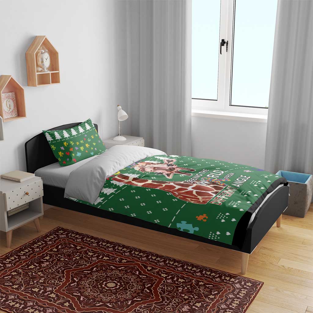 Green autism-themed duvet with giraffe, trees, and world text, with matching pillowcases
