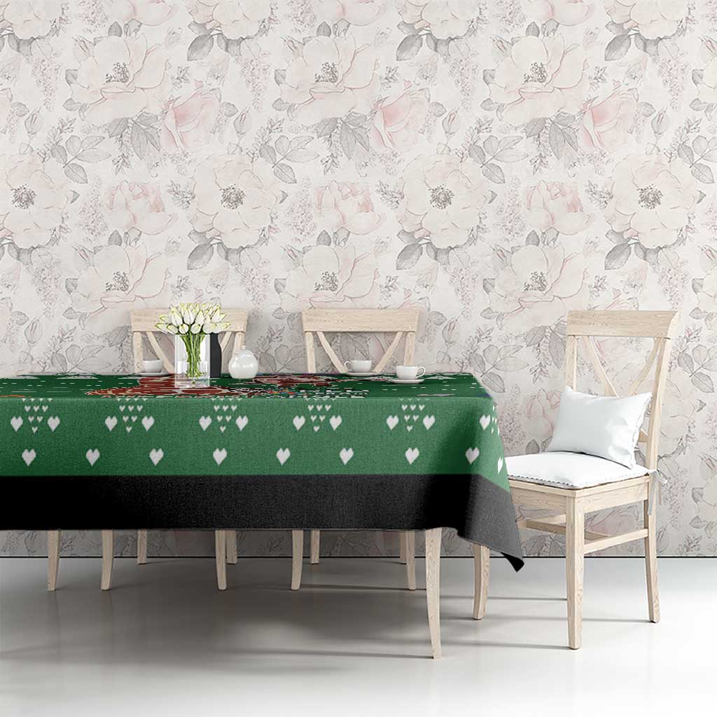 Green tablecloth with heart-and-leaf print, draped on dining table