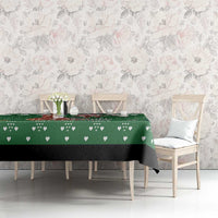 Green tablecloth with heart-and-leaf print, draped on dining table