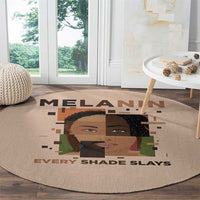 Beige round area rug showing a stylized woman portrait and "EVERY SHADE SLAYS" text