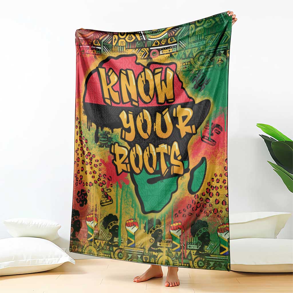 Graffiti African map throw blanket with bold text design, draped over bed