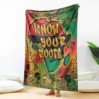 Graffiti African map throw blanket with bold text design, draped over bed