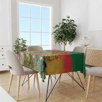 Colorful graffiti African map tablecloth draped over dining table with chairs