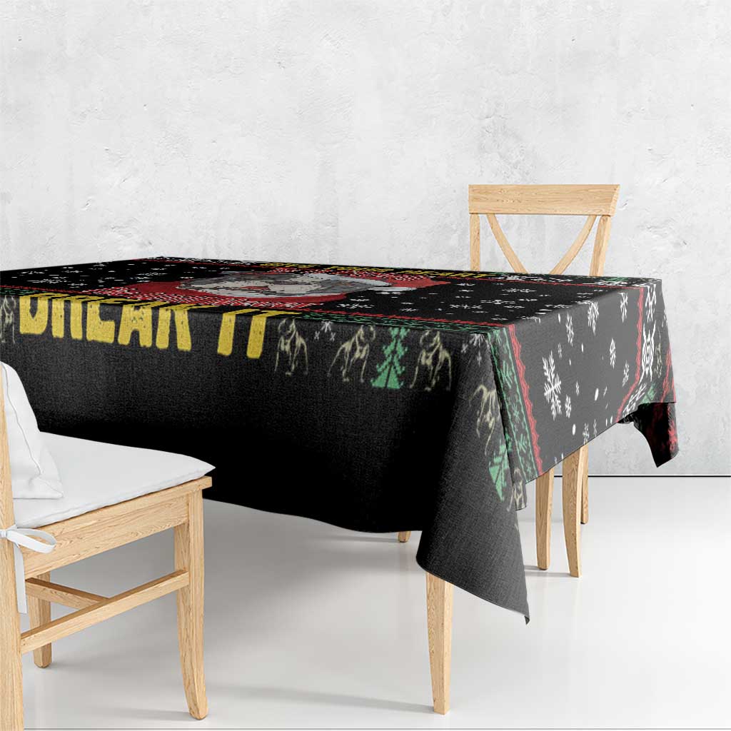 Black tablecloth with colorful border, snowflake pattern and pitbull graphic on tabletop