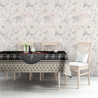 Black holiday dog tablecloth with snowflake pattern, centered on dining table with chairs