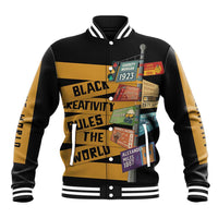 Black unisex baseball jacket with gold graphic print, button front, striped cuffs