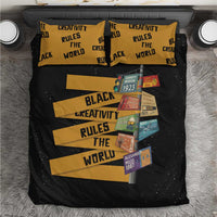 Black bedding set with gold stripes and “Black Creativity Rules The World” typography
