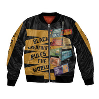 Black bomber jacket, full-zip front, gold graphic text and side stripe panels