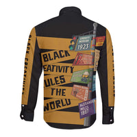 Black long-sleeve button-down shirt with African-style poster graphic, back view