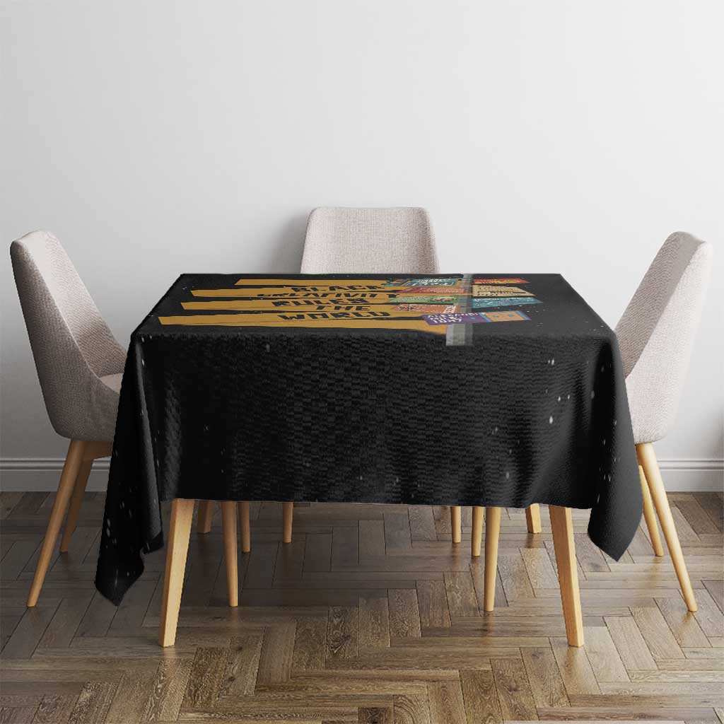 Black tablecloth on square dining table with colorful headline graphic
