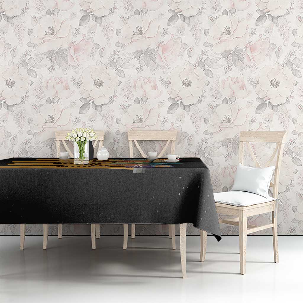 Black tablecloth on dining table with “African creativity” text print