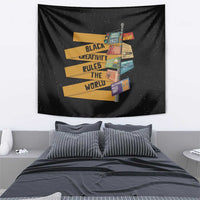 Black tapestry featuring yellow "Black Creativity Rules The World" text and colorful collage