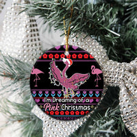 Black ceramic round ornament with pink flamingo hanging, “I'm Dreaming of a Pink Christmas”