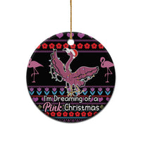 Black ceramic round ornament with pink flamingo and “I'm Dreaming of a Pink Christmas” text