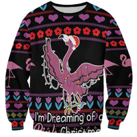 Black unisex sweatshirt with pink flamingo graphic and festive Christmas pattern