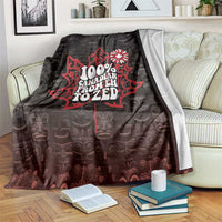 Black throw blanket with red Canadian graphic and white floral emblem