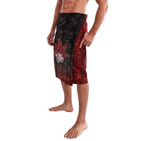 Men's black and red graphic board shorts with side panel print, knee length
