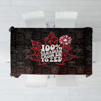 Dark tablecloth with red and white Canada map graphic and patterned icons