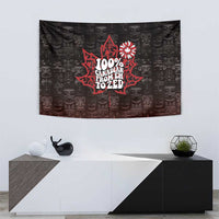 Black tapestry with red maple-leaf design and repeating face pattern, wall-hanging