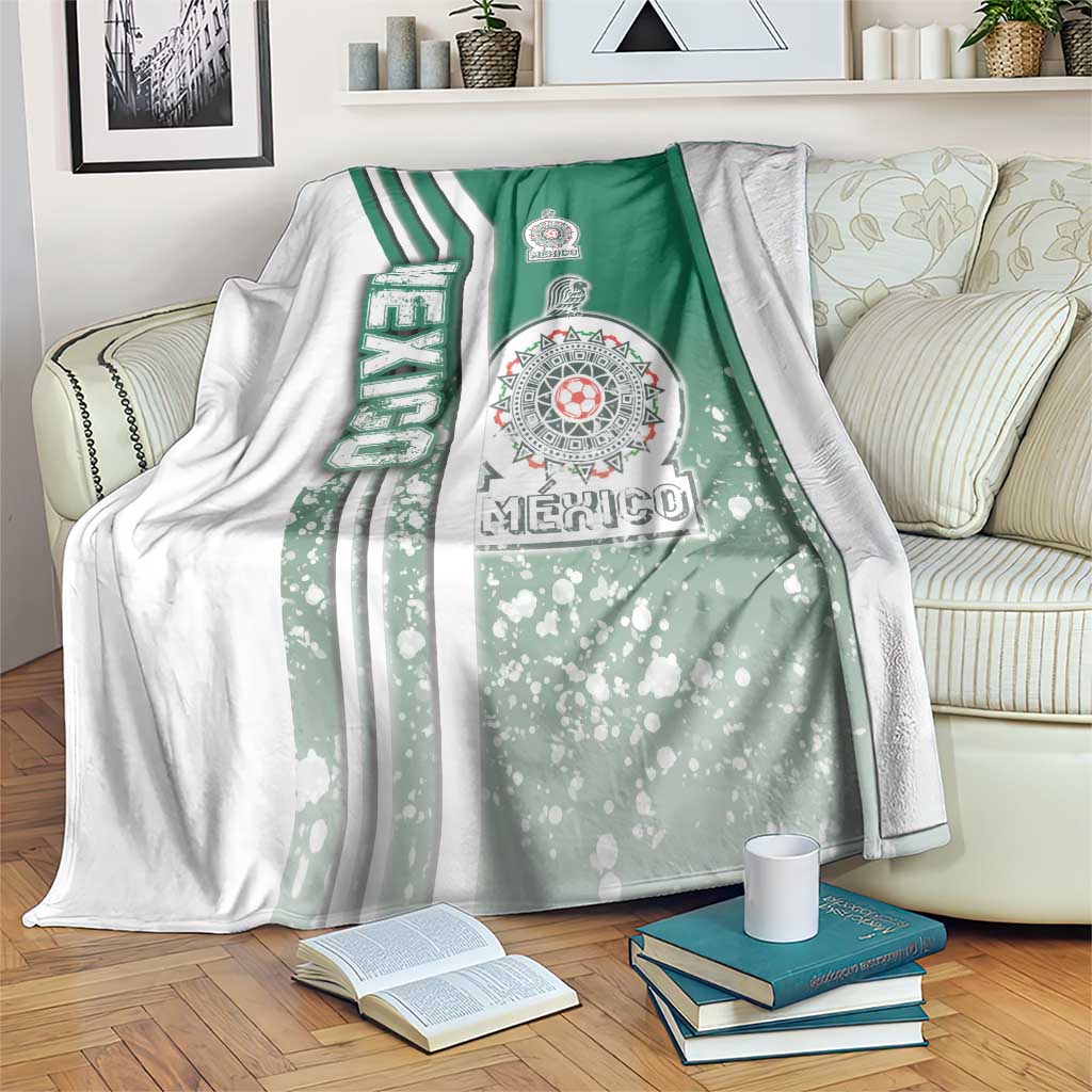 Mexico soccer blanket with green and white stripes and Mexico emblem, draped on sofa