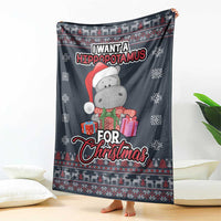 Christmas blanket draped with hippopotamus in red scarf holding gift boxes, navy holiday print