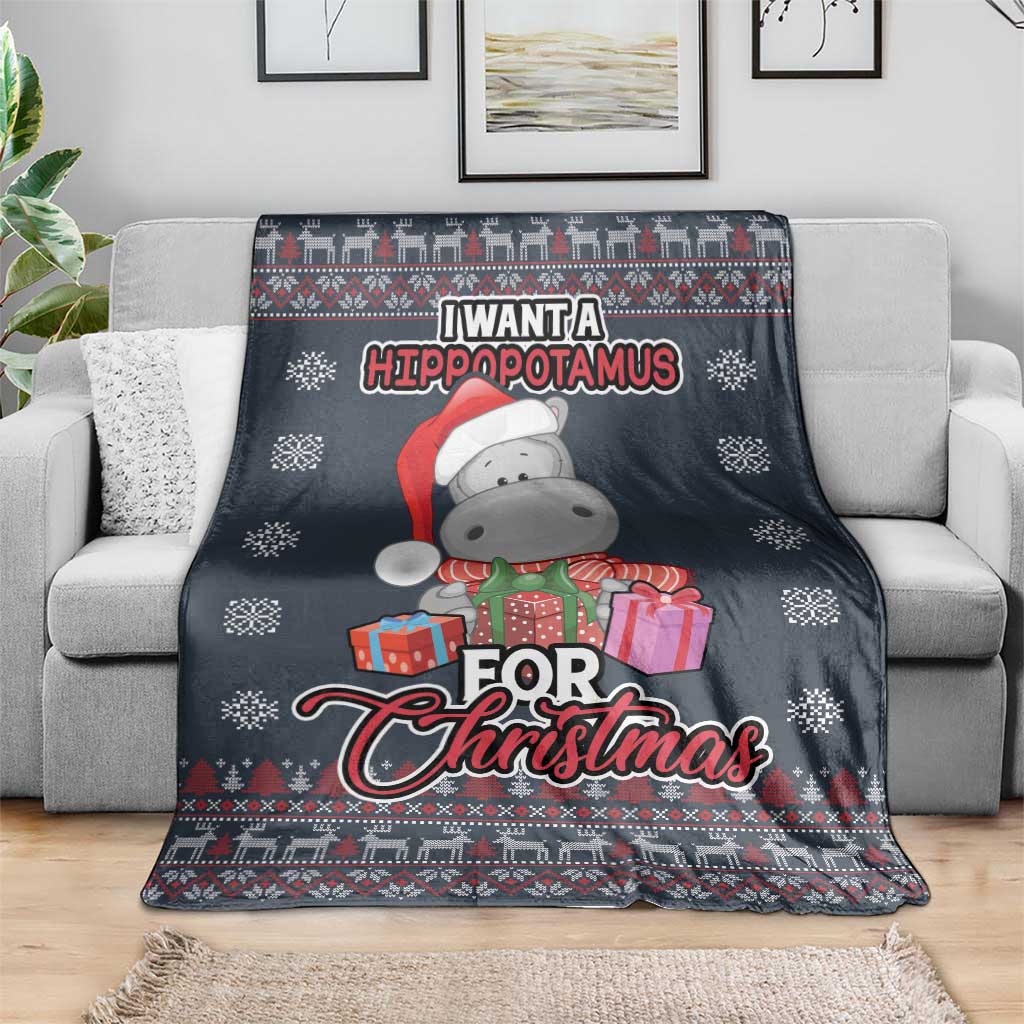 Christmas blanket on sofa with hippopotamus in green outfit, red scarf, and presents design