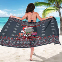 Dark blue Christmas hippo sarong held out, with snowflakes and festive border print