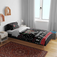 Black Christmas Krampus bedding set on a bed with coordinating pillowcases