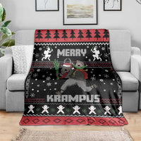 Black Krampus throw blanket with “KRAMPUS” at center and smiling figures across border