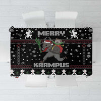 Black Christmas tablecloth with Krampus graphic and snowflake pattern border