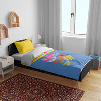 Blue bedding set on bed with yellow pillow; colorful island-themed print across duvet
